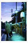 1970s 1980s Impatient Anonymous Man Waiting For Commuter Train by Anonymous
