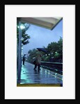 1970s 1980s Anonymous Business Man Holding Umbrella Waiting For A Commuter Train by Anonymous