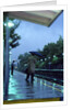 1970s 1980s Anonymous Business Man Holding Umbrella Waiting For A Commuter Train by Corbis