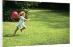 1980s Little Girl With A Red Balloon Running In The Grass by Anonymous