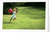 1980s Little Girl With A Red Balloon Running In The Grass by Anonymous