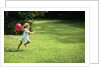 1980s Little Girl With A Red Balloon Running In The Grass by Anonymous