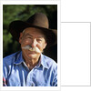 1990s Portrait Of Smiling Cowboy With Gray Mustache Black Hat Blue Shirt Looking At Camera by Corbis