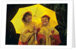 1990s Two Laughing Young Girls Holding A Yellow Umbrella And Wearing Yellow Rain Ponchos by Anonymous