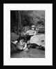 1950s Lazy Fisherman Lying Back On Rock With Hat Pulled Over Eyes Fishing In Creek by Anonymous