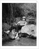 1950s Lazy Fisherman Lying Back On Rock With Hat Pulled Over Eyes Fishing In Creek by Anonymous