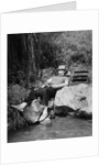1950s Lazy Fisherman Lying Back On Rock With Hat Pulled Over Eyes Fishing In Creek by Anonymous