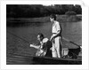 1930s Man Father Teenage Boy Son Dog In Row Boat Fishing In Pond by Anonymous