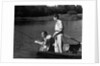 1930s Man Father Teenage Boy Son Dog In Row Boat Fishing In Pond by Anonymous