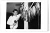 1950s Smiling Boy Proudly Displaying His Fish Catch Looking At Camera by Anonymous