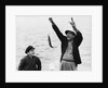 1950s 1960s Boy Son Fishing With Man Father Or Grandfather Holding Up Caught Fish On Line Laughing Having Fun by Corbis