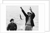 1950s 1960s Boy Son Fishing With Man Father Or Grandfather Holding Up Caught Fish On Line Laughing Having Fun by Corbis