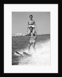 1960s Man Water Skiing With Woman In Bathing Suit Riding On Shoulders by Anonymous