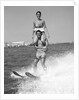 1960s Man Water Skiing With Woman In Bathing Suit Riding On Shoulders by Anonymous