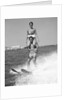 1960s Man Water Skiing With Woman In Bathing Suit Riding On Shoulders by Anonymous