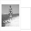 1960s Man Water Skiing With Woman In Bathing Suit Riding On Shoulders by Anonymous