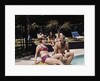 1960s Four People On Patio Couple Man Woman Sitting On Edge Of Swimming Pool by Anonymous
