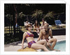 1960s Four People On Patio Couple Man Woman Sitting On Edge Of Swimming Pool by Anonymous