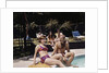 1960s Four People On Patio Couple Man Woman Sitting On Edge Of Swimming Pool by Anonymous