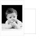 1940s Cute Baby Sucking Thumb Looking At Camera by Anonymous