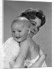 1960s Thoughtful Pensive Mother Holding Happy Baby Child by Anonymous