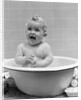 1940s Smiling Baby In Bath Covered In Soap Suds Laughing Holding Toy by Anonymous