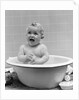 1940s Smiling Baby In Bath Covered In Soap Suds Laughing Holding Toy by Anonymous