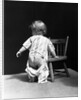 1930s Baby Wearing Drop Seat Pajamas Showing Bare Bottom Leaning On Chair by Anonymous