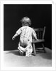 1930s Baby Wearing Drop Seat Pajamas Showing Bare Bottom Leaning On Chair by Anonymous