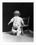 1930s Baby Wearing Drop Seat Pajamas Showing Bare Bottom Leaning On Chair by Anonymous