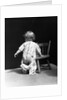 1930s Baby Wearing Drop Seat Pajamas Showing Bare Bottom Leaning On Chair by Anonymous