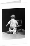 1930s Baby Wearing Drop Seat Pajamas Showing Bare Bottom Leaning On Chair by Anonymous