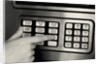 1980s Hand Pressing Buttons On Panel Of Vintage Automatic Teller Machine Atm by Anonymous