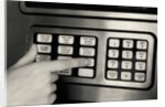 1980s Hand Pressing Buttons On Panel Of Vintage Automatic Teller Machine Atm by Anonymous