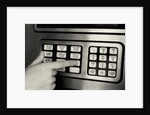 1980s Hand Pressing Buttons On Panel Of Vintage Automatic Teller Machine Atm by Anonymous