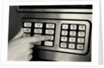 1980s Hand Pressing Buttons On Panel Of Vintage Automatic Teller Machine Atm by Anonymous