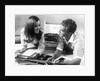 1960s Teen Couple Playing Lp Vinyl Records On Portable Phonograph by Anonymous