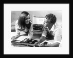 1960s Teen Couple Playing Lp Vinyl Records On Portable Phonograph by Anonymous