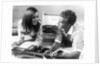 1960s Teen Couple Playing Lp Vinyl Records On Portable Phonograph by Anonymous