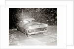 1950s Snow Covered Automobile Driving On Road In Deepening Winter Blizzard Snow by Anonymous