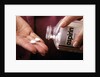 1990s Female Hand Taking Two Aspirin Tablets From Bottle by Anonymous