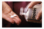 1990s Female Hand Taking Two Aspirin Tablets From Bottle by Anonymous