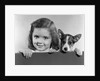 1940s 1950s Portrait Of Little Girl With Small Dog Looking At Camera by Anonymous