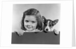 1940s 1950s Portrait Of Little Girl With Small Dog Looking At Camera by Anonymous