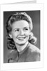 1940s Portrait Of Smiling Woman With Long Blond Curly Hair by Anonymous