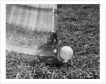 1960s Moving Driver Golf Club Hitting Ball On Tee In Grass by Anonymous