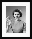 1960s Alarmed Woman Holding Up Her Hand To Stop Something by Anonymous