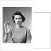1960s Alarmed Woman Holding Up Her Hand To Stop Something by Anonymous
