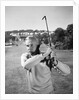 1960s Man Playing Golf Hitting Golf Ball From Fairway With Iron Club by Anonymous