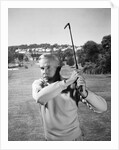1960s Man Playing Golf Hitting Golf Ball From Fairway With Iron Club by Anonymous